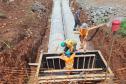Pessoas trabalhando na obra de concretagem na duplicação em Guarapuava
