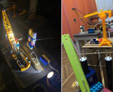 As peças de montar, carrinhos e bonecos de brinquedo usados para recriar a obra